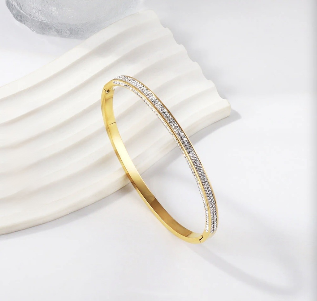Aurelia Sparkling Crystal Bangle – styled on white textured surface